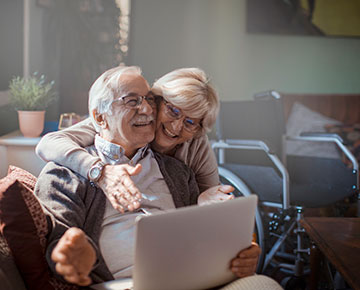 Couple looking at a laptop computer together