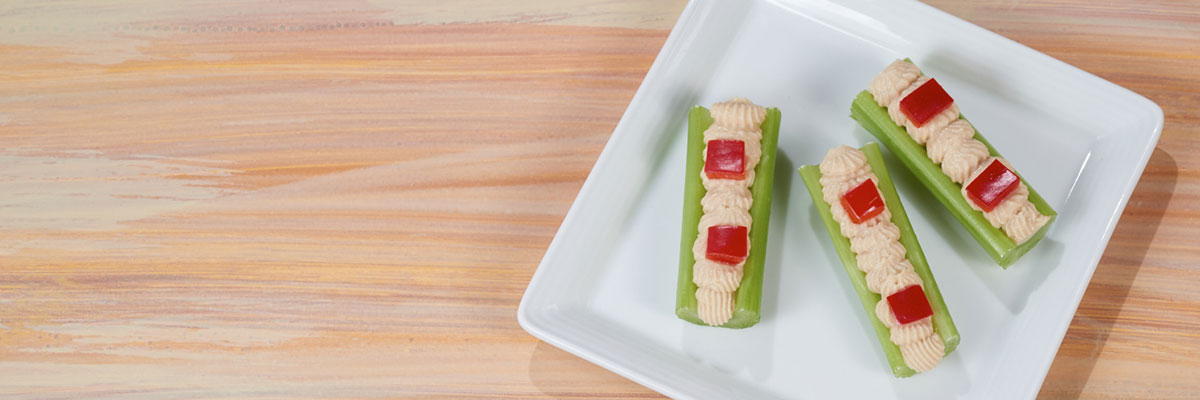 Hummus and Red Pepper Celery Logs