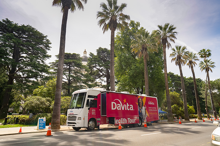 DaVita Health Tour bus parked on the side of a road