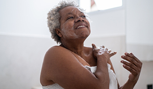 Black woman caring for her skin.