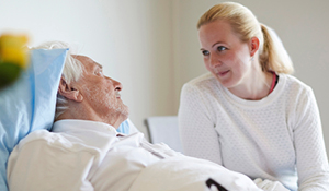 Elderly man patient with visitor.