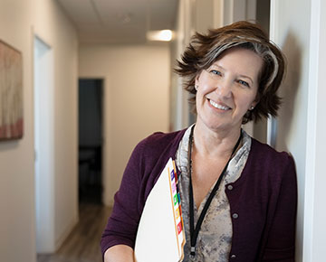 Healthcare provider standing in hallway